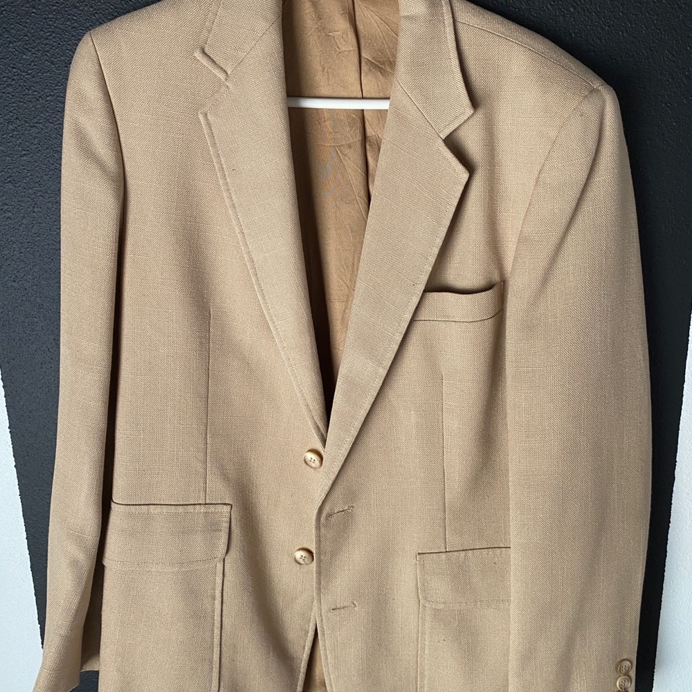 Tan suit.